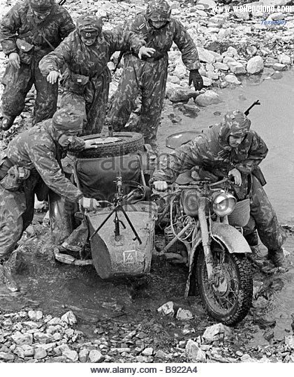 reconnaissance-men-taking-motorcycle-across-the-stream-during-exercises-b922a4.jpg